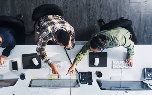 High angle shot of a group of call centre agents working in an office